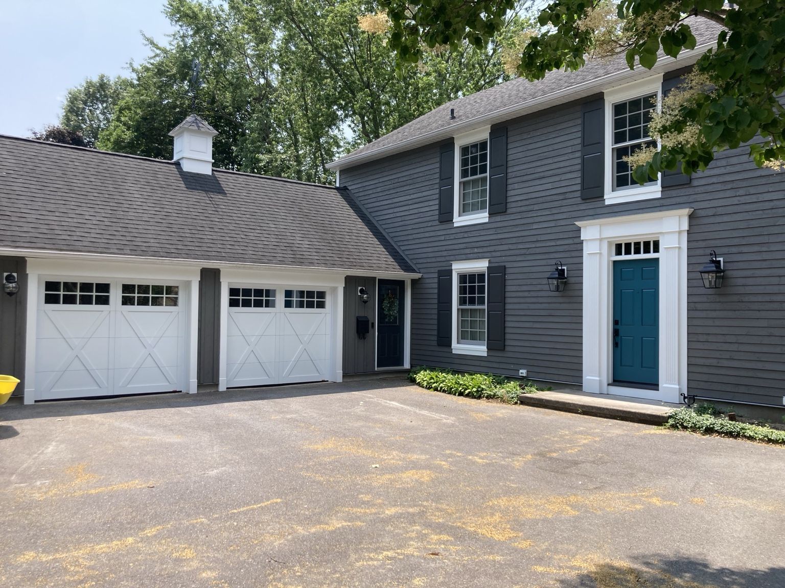 Garage with custom cupola and architectural exterior details