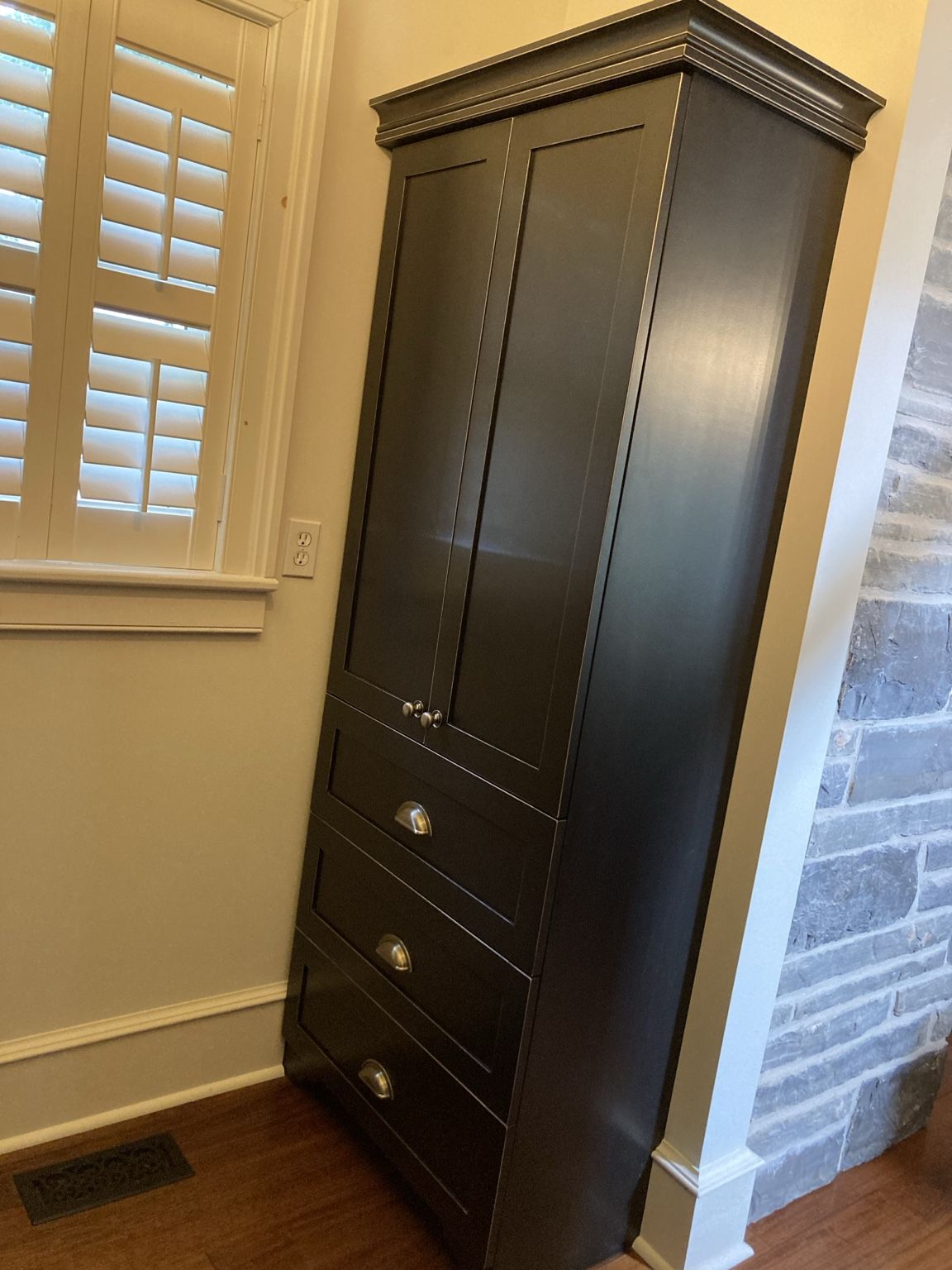 Custom black pantry cabinet